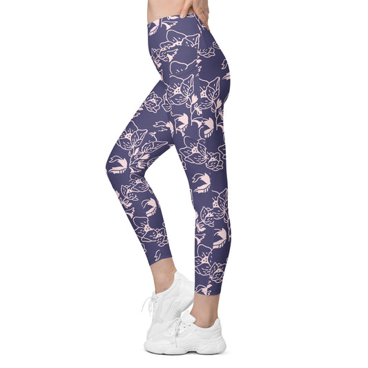 High-waist lavender leggings with light pink floral print and side pockets, worn with white sneakers.
