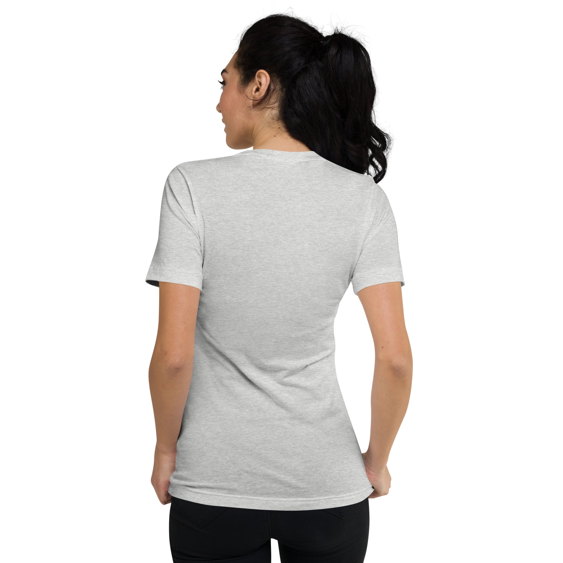 Heather gray unisex V-neck tee with short sleeves shown from the back on a woman with dark hair in a ponytail.