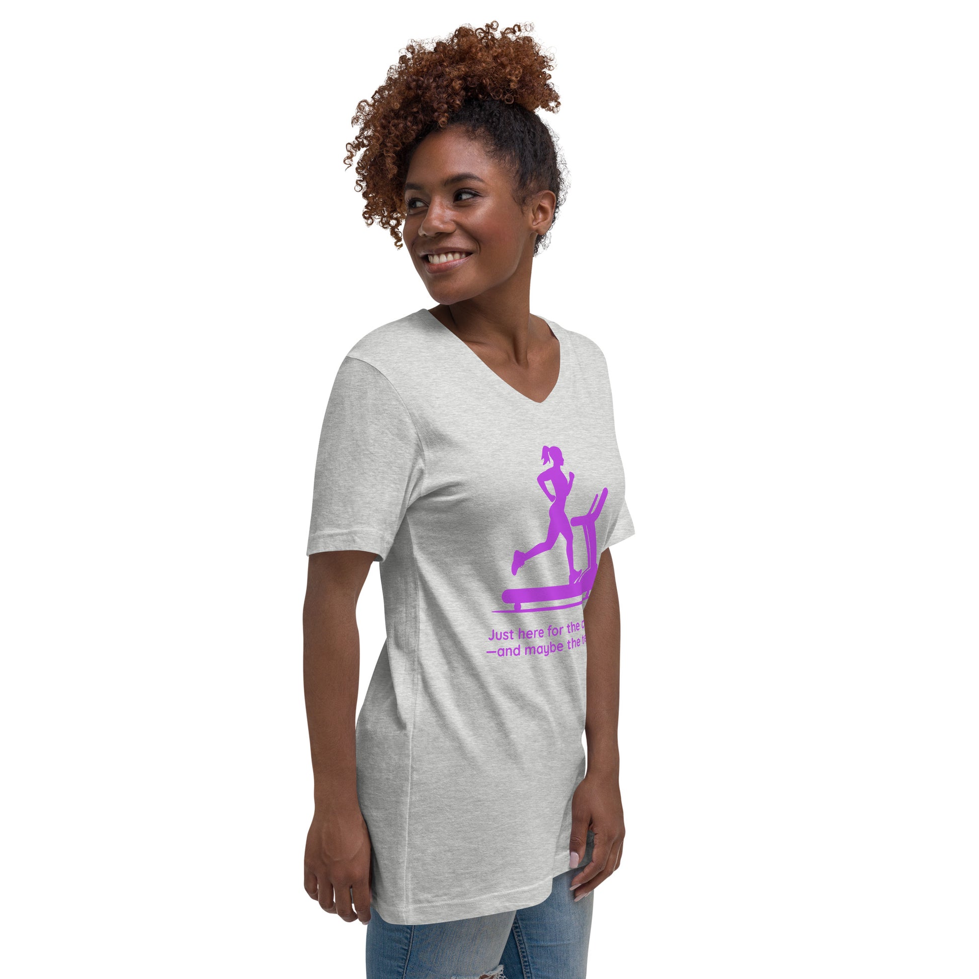 Light grey V-neck tee with purple graphic of a woman on a treadmill, worn by a smiling woman.
