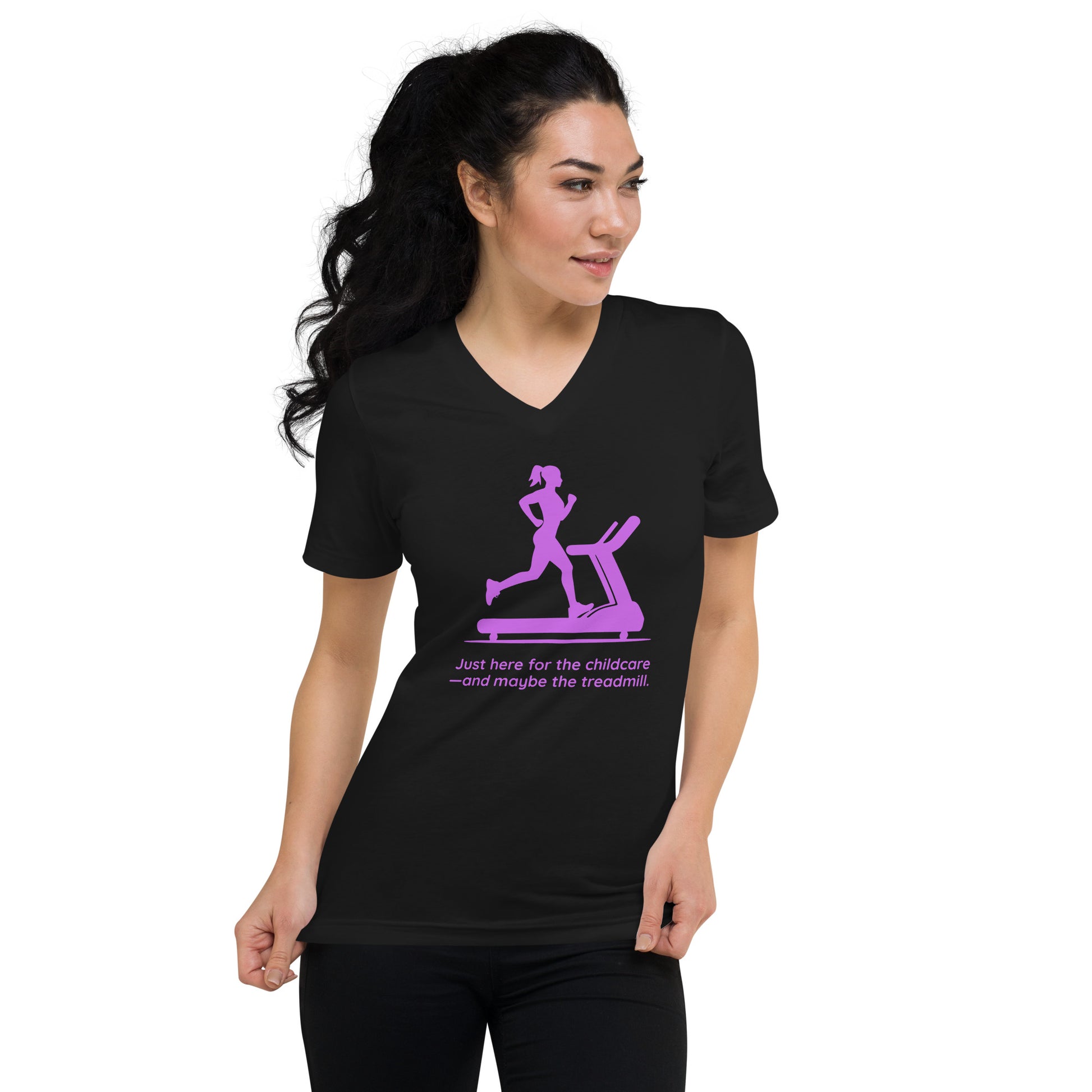 Black V-neck tee with pink treadmill graphic and humorous "Just here for the childcare—and maybe the treadmill" text.
