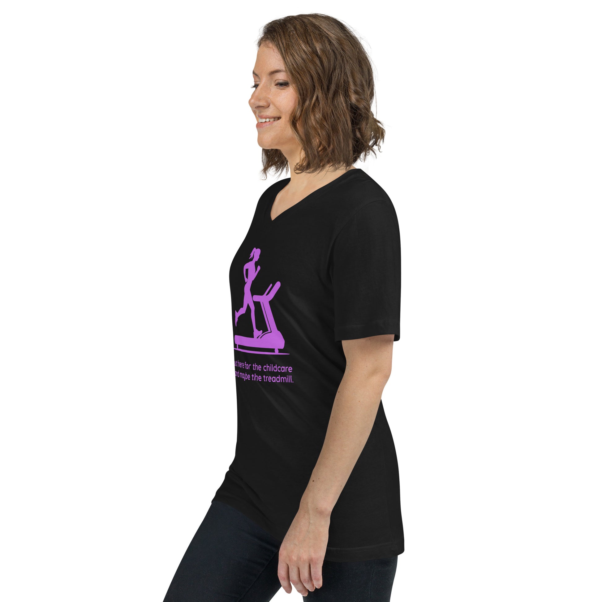 Black V-neck tee with purple graphic of a woman on a treadmill and humorous text, worn by a smiling woman in profile.
