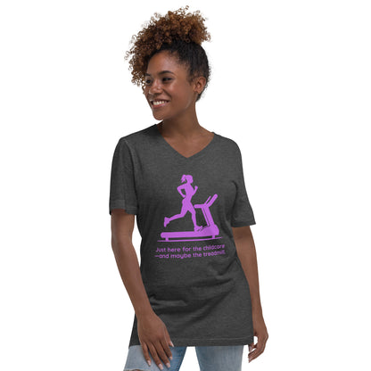Dark grey heather v-neck tee with pink treadmill graphic and "Just Here for the Childcare—and Maybe the Treadmill" text.