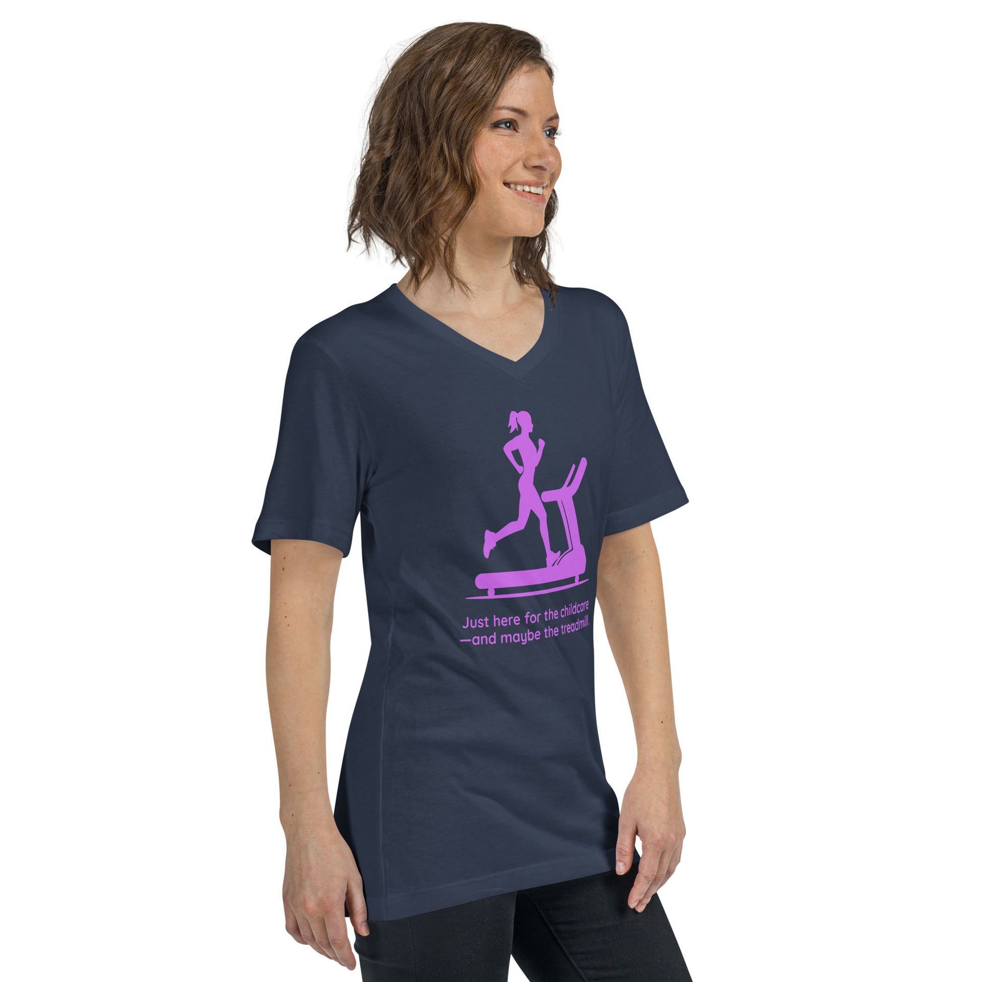 Navy V-neck tee with pink treadmill graphic and "Just here for the childcare—and maybe the treadmill" text.