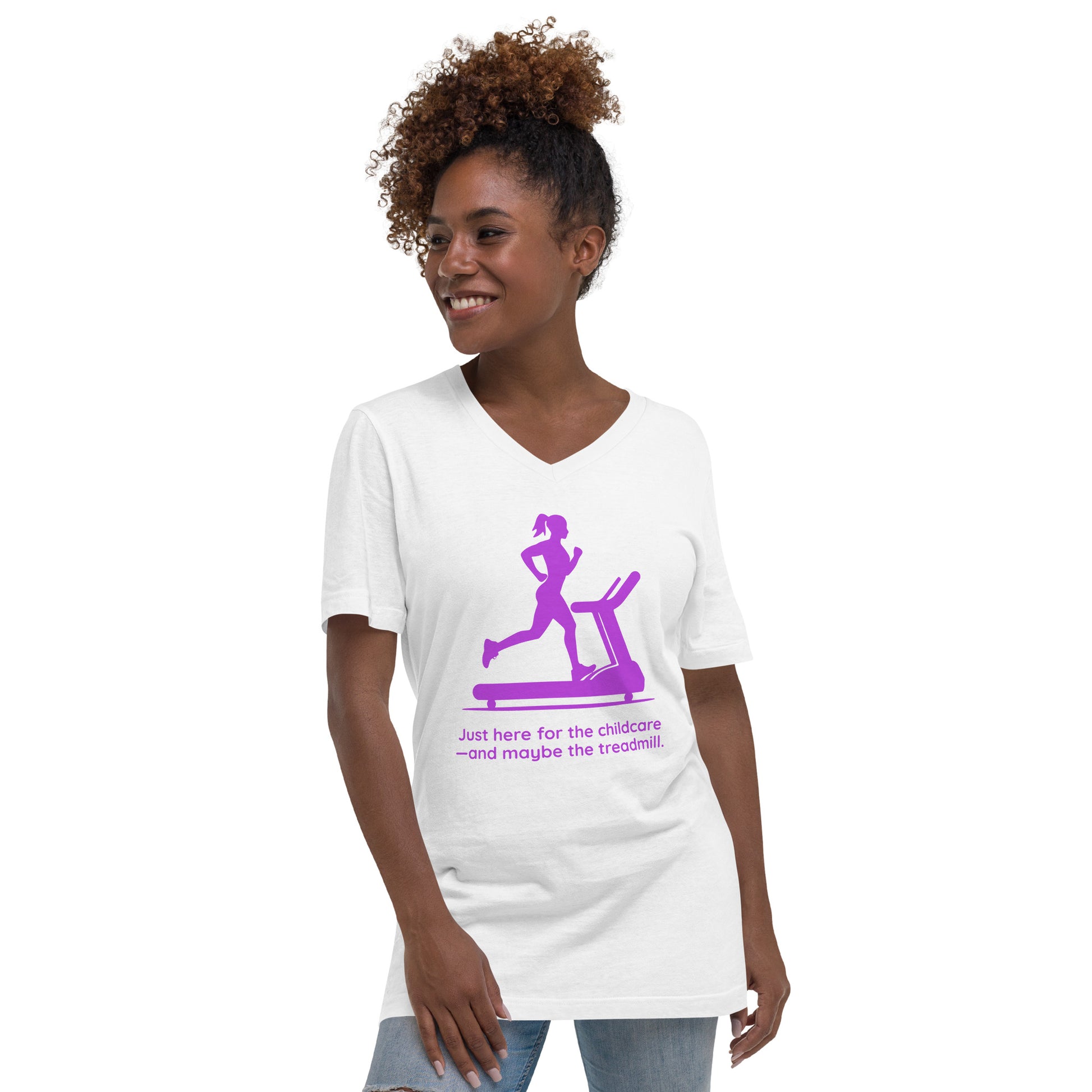 White V-neck tee with purple graphic of a woman jogging on a treadmill and text "Just Here for the Childcare—and Maybe the.