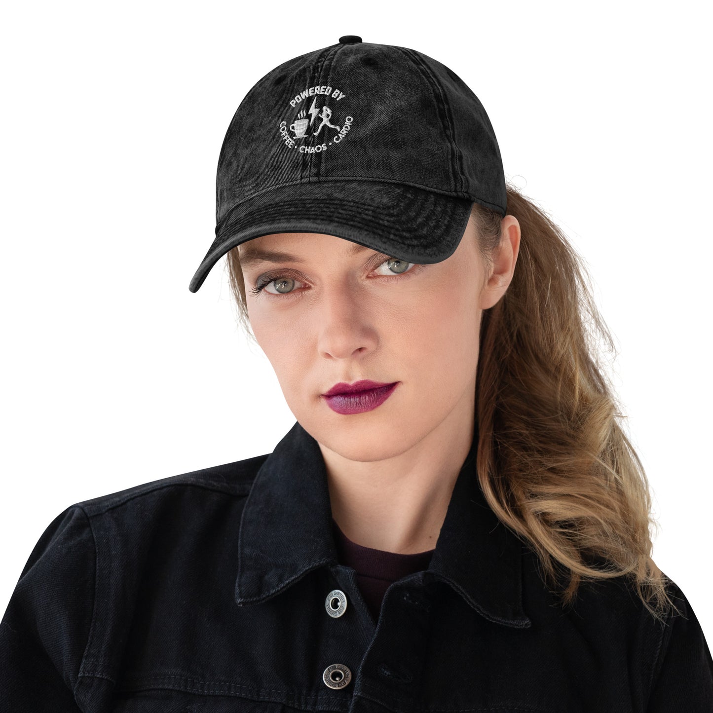 Black vintage cotton twill cap with curved brim and white embroidered “Powered by Coffee, Chaos & Cardio” logo.
