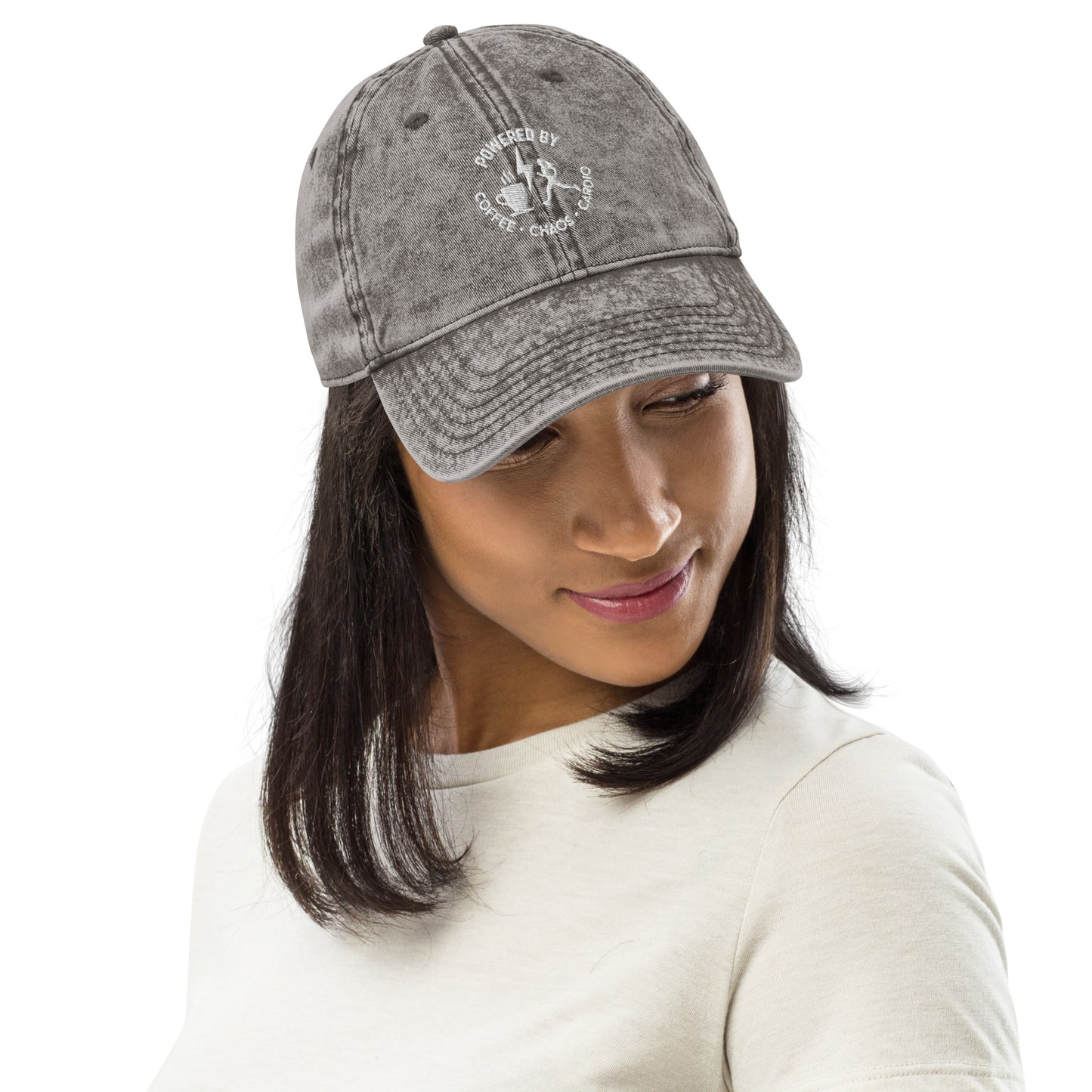 Charcoal grey vintage cotton twill cap with distressed finish and embroidered circular logo on front.