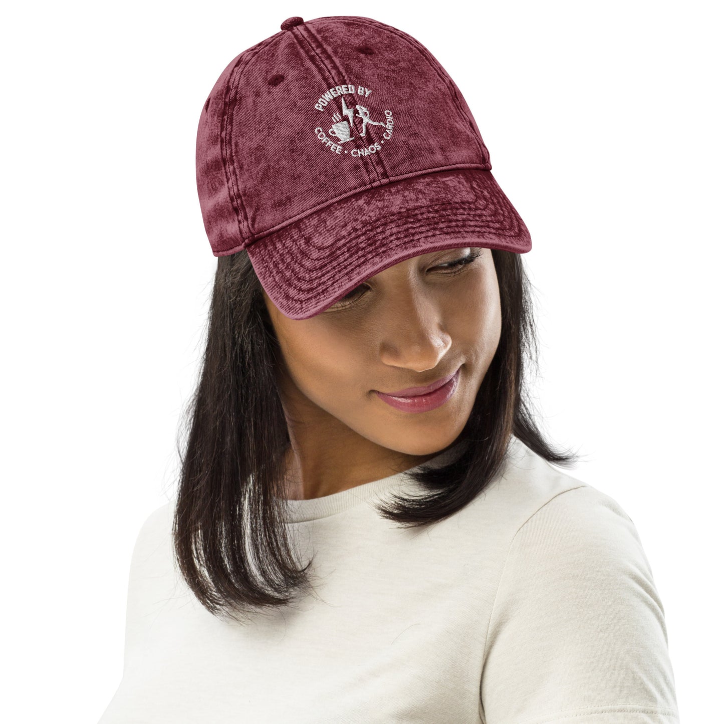 Maroon vintage cotton twill cap with white embroidered "Powered by Coffee, Chaos & Cardio" text and graphic on front.