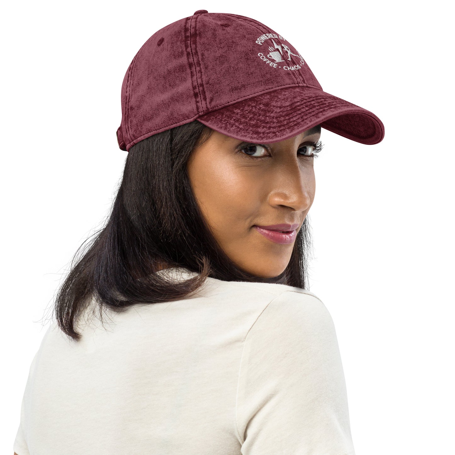 Maroon vintage cotton twill cap with white embroidered "Powered by Coffee, Chaos & Cardio" text and curved brim.