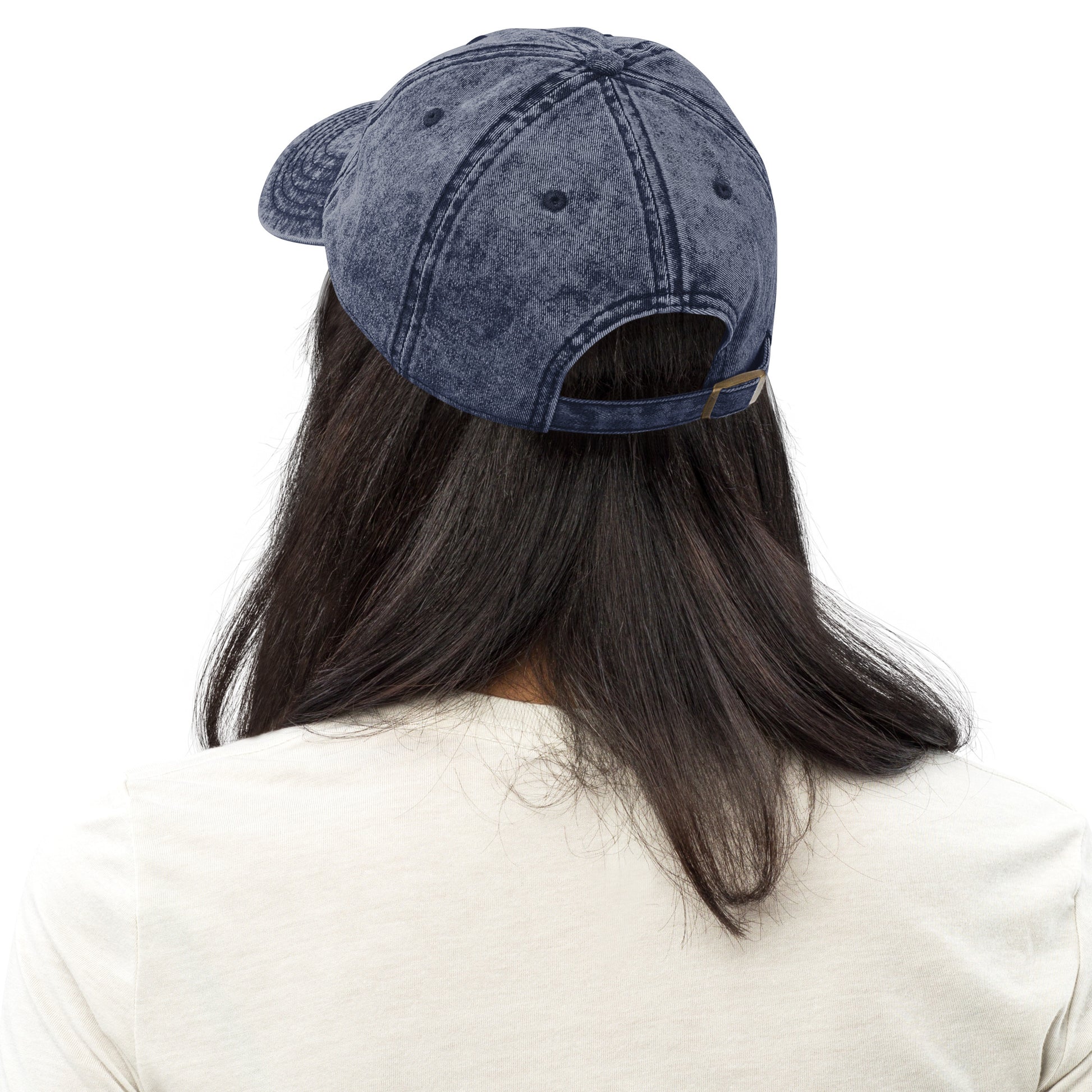 Charcoal grey vintage cotton twill cap with adjustable strap shown from back on model with long dark hair.